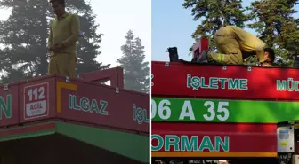 Yangınla mücadele arasında araç üzerinde namazını kıldı
